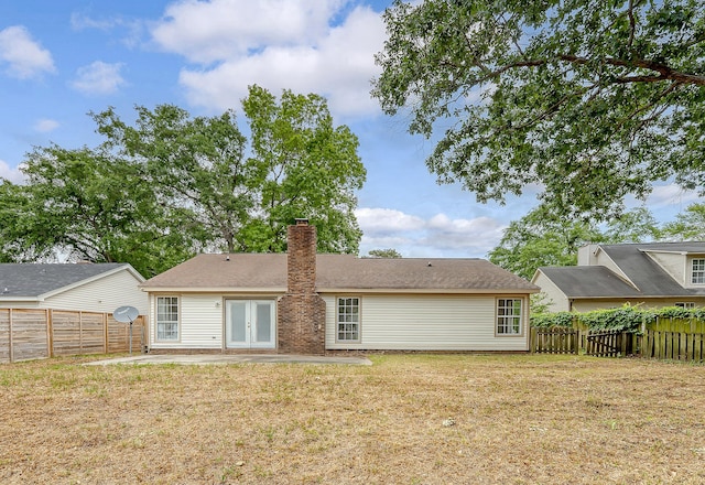 315 Indigo Rd, Goose Creek, SC 29445 - back of house featuring a patio area, a chimney, french doors, a fenced backyard, and a yard