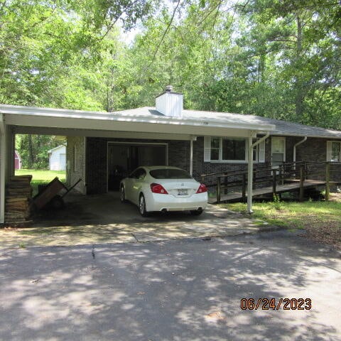 view of front of house featuring a carport