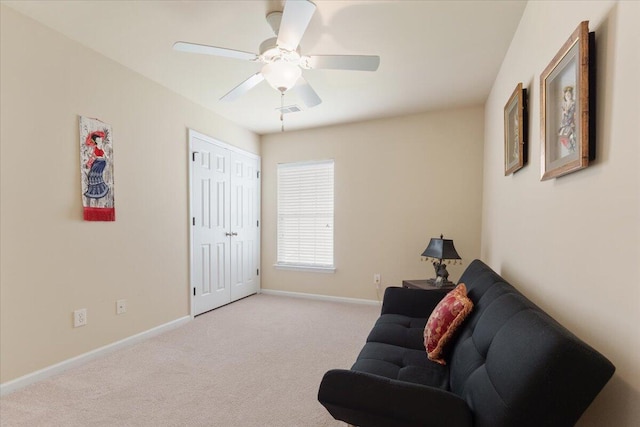 living area featuring ceiling fan, carpet, baseboards, and visible vents