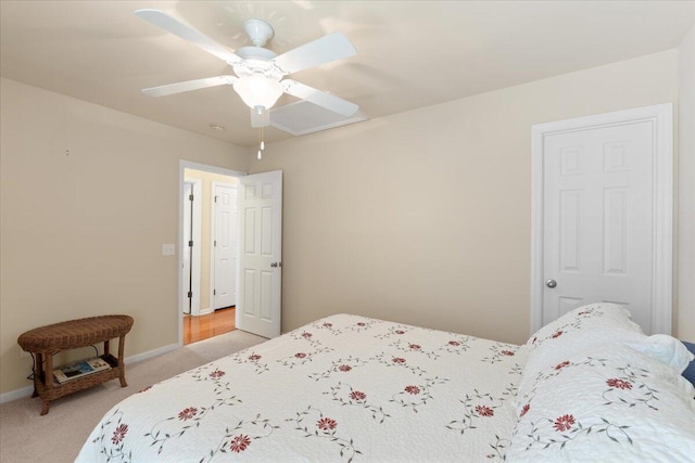 bedroom featuring a ceiling fan, baseboards, and light colored carpet