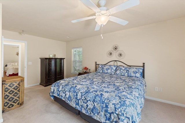 carpeted bedroom with baseboards and ceiling fan