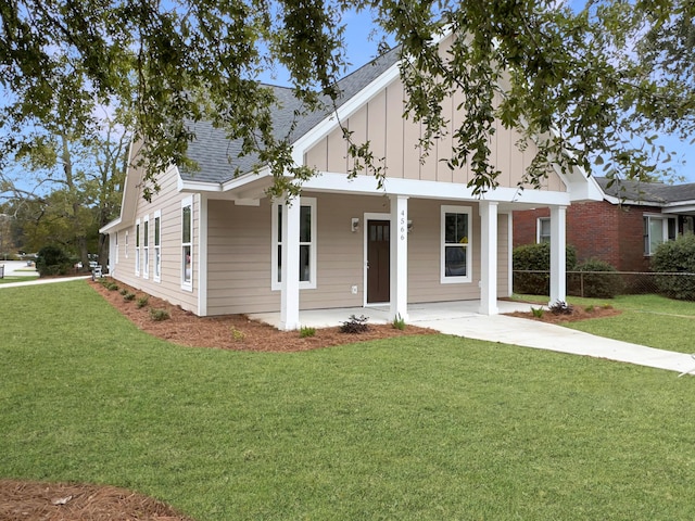 4566 Durant Ave, North Charleston, SC 29405 - view of front of house featuring board and batten siding, a porch, and roof with shingles