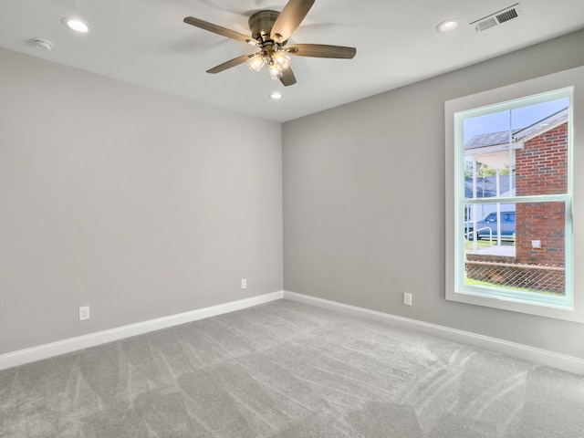 carpeted empty room with ceiling fan