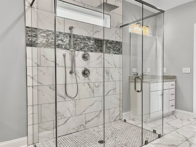 bathroom featuring vanity and a shower with shower door