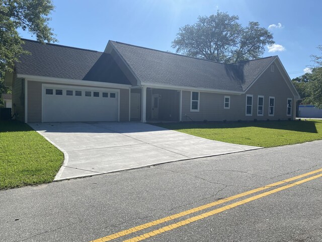 4566 Durant Ave, North Charleston, SC 29405 - ranch-style home featuring an attached garage, a front lawn, driveway, a shingled roof, and central air condition unit