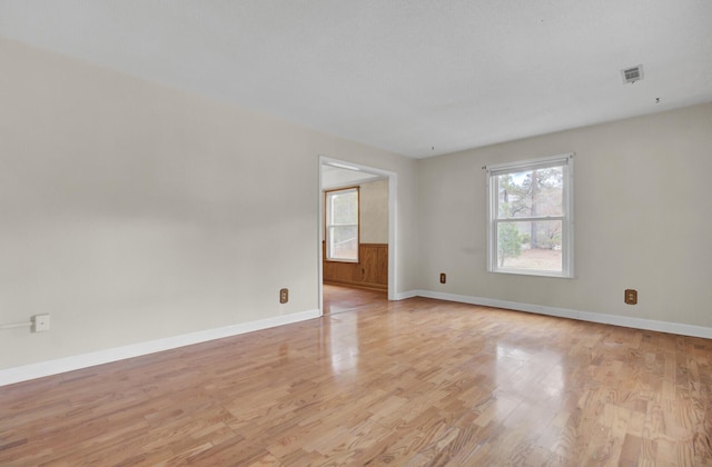 unfurnished room with light hardwood / wood-style flooring