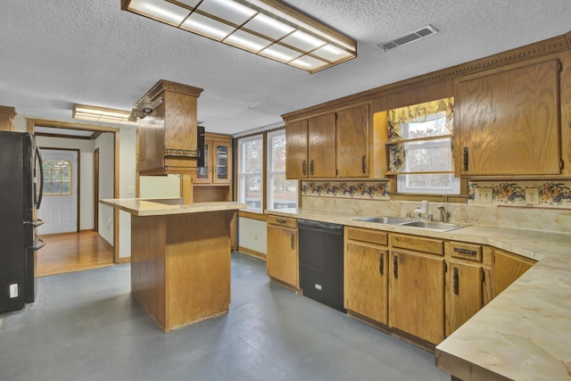 kitchen featuring a center island, sink, a textured ceiling, decorative backsplash, and black appliances