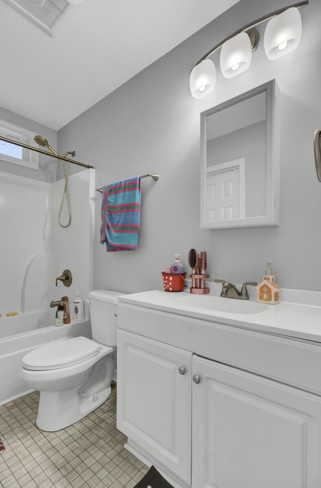 full bathroom featuring tile patterned flooring, vanity,  shower combination, and toilet