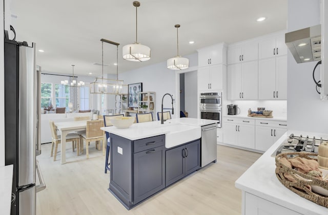 3041 Robeson Trce, Johns Island, SC 29455 - kitchen with stainless steel appliances, light wood-style flooring, light countertops, a sink, and recessed lighting