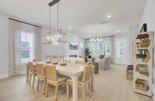 3041 Robeson Trce, Johns Island, SC 29455 - dining space with a chandelier, light wood-style floors, plenty of natural light, and recessed lighting