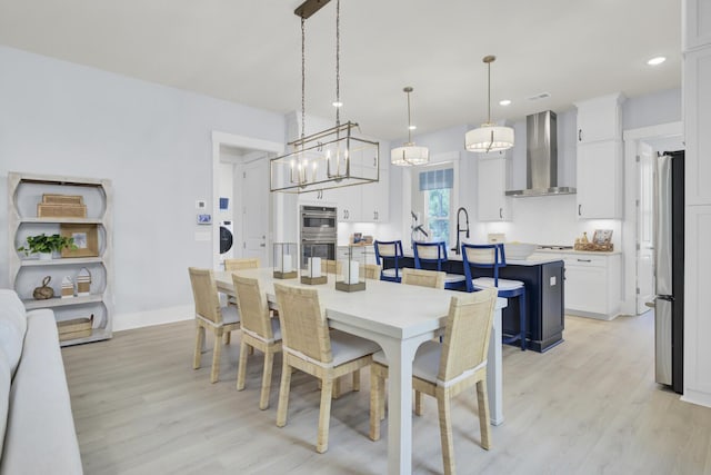 3041 Robeson Trce, Johns Island, SC 29455 - dining area with light wood-type flooring, recessed lighting, baseboards, a chandelier, and washer / dryer