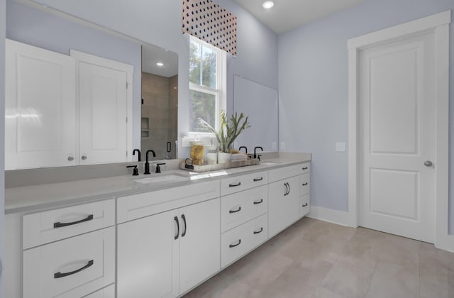 3041 Robeson Trce, Johns Island, SC 29455 - bathroom with double vanity, a shower stall, baseboards, and recessed lighting