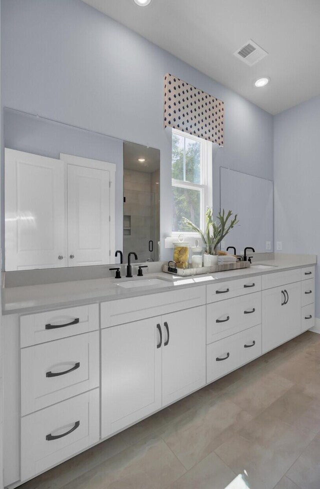 3041 Robeson Trce, Johns Island, SC 29455 - bathroom with double vanity and a tile shower
