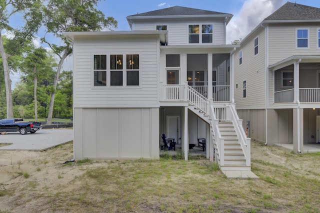 3041 Robeson Trce, Johns Island, SC 29455 - rear view of property featuring stairs and a sunroom
