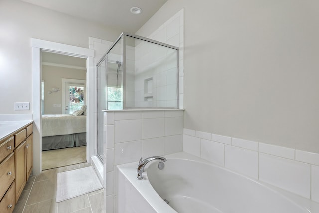 129 Howard Mary Dr Unit A, Charleston, SC 29412 - ensuite bathroom featuring a garden tub, a shower stall, vanity, and tile patterned floors