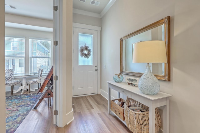 129 Howard Mary Dr Unit A, Charleston, SC 29412 - entrance foyer with plenty of natural light, wood finished floors, and crown molding