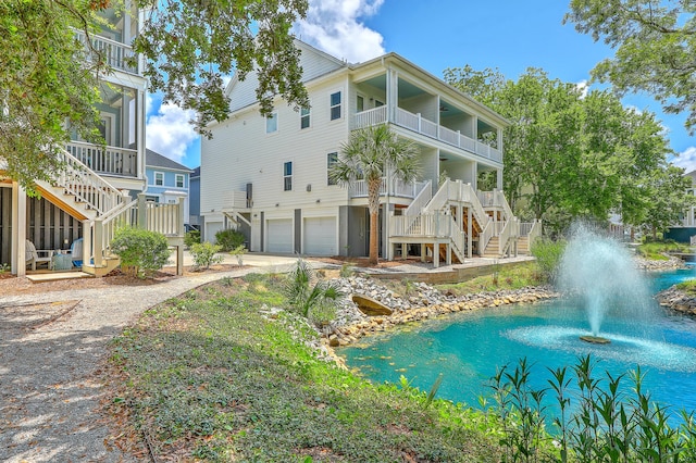 129 Howard Mary Dr Unit A, Charleston, SC 29412 - rear view of property featuring stairs, a garage, and a balcony