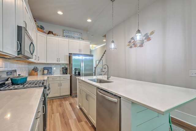 129 Howard Mary Dr Unit A, Charleston, SC 29412 - kitchen with appliances with stainless steel finishes, light countertops, light wood-style flooring, decorative backsplash, and recessed lighting
