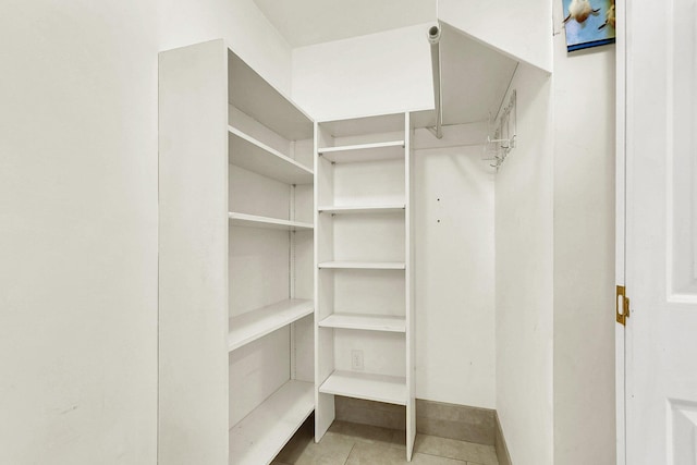 walk in closet featuring light tile patterned floors