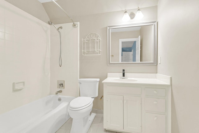 full bathroom featuring tiled shower / bath, toilet, tile patterned floors, and vanity