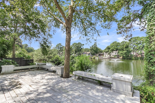 exterior space with a deck with water view