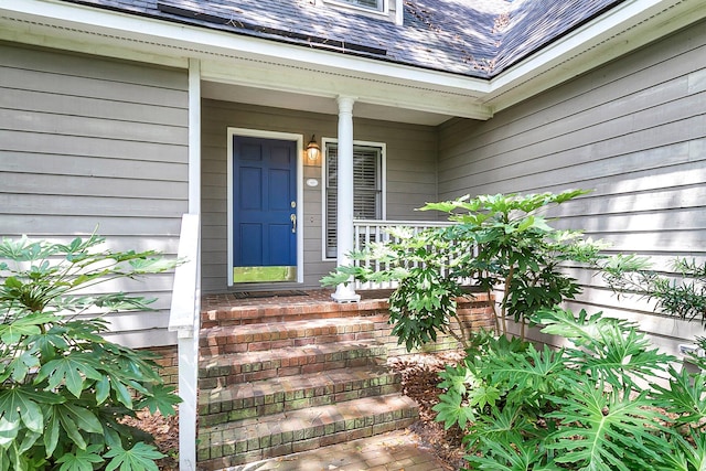 property entrance featuring covered porch