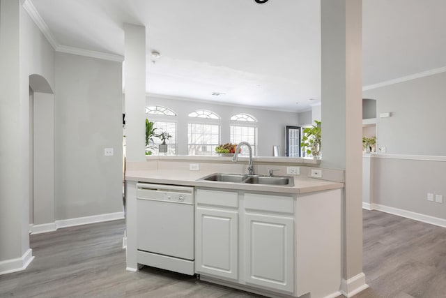 kitchen featuring white cabinetry, a sink, light countertops, dishwasher, and light wood-type flooring