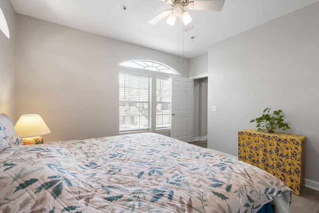 bedroom with baseboards and ceiling fan