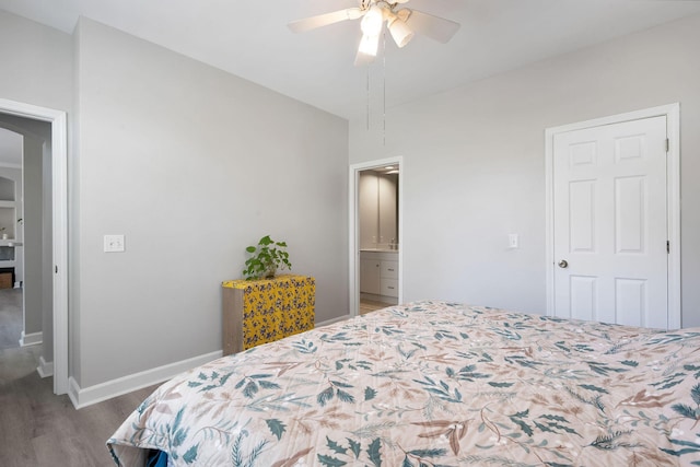 bedroom with ceiling fan, baseboards, and wood finished floors