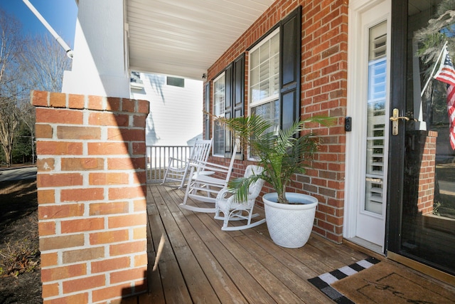 wooden deck featuring a porch