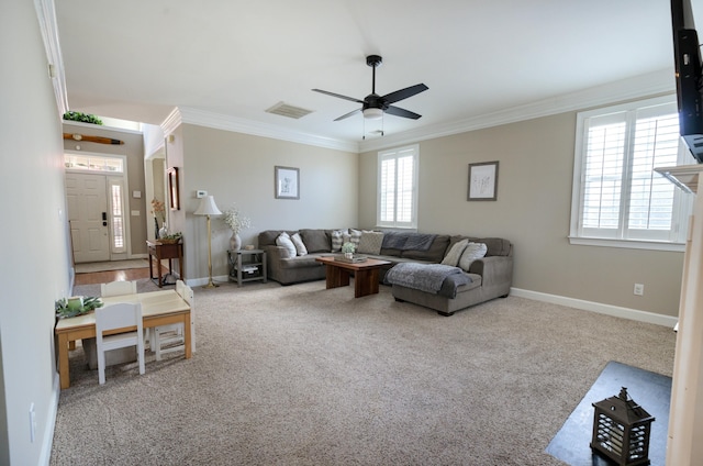 carpeted living room featuring crown molding and ceiling fan