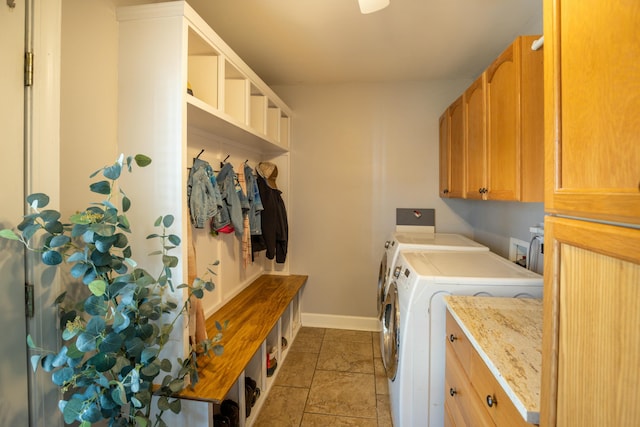 washroom featuring cabinets and separate washer and dryer