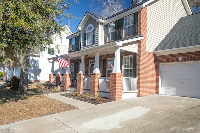 view of front facade featuring a garage and a porch