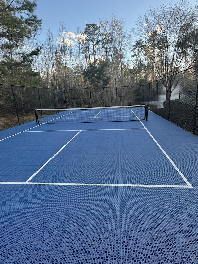 view of sport court featuring basketball hoop