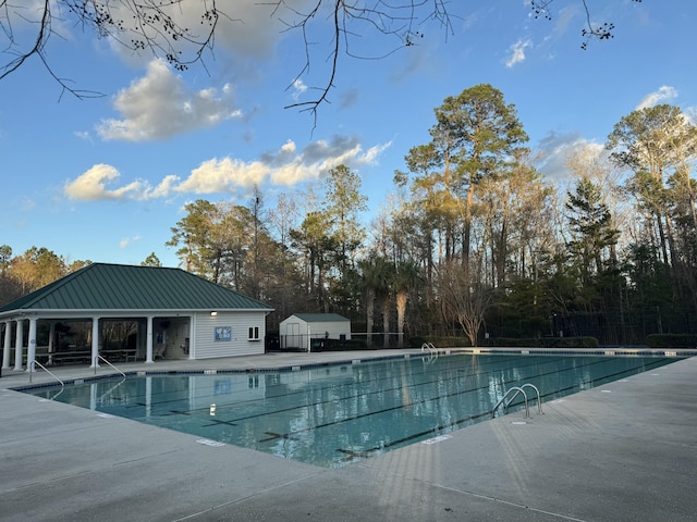 view of swimming pool with a patio area