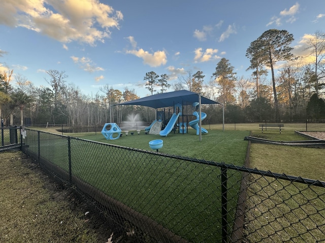 view of jungle gym with a lawn