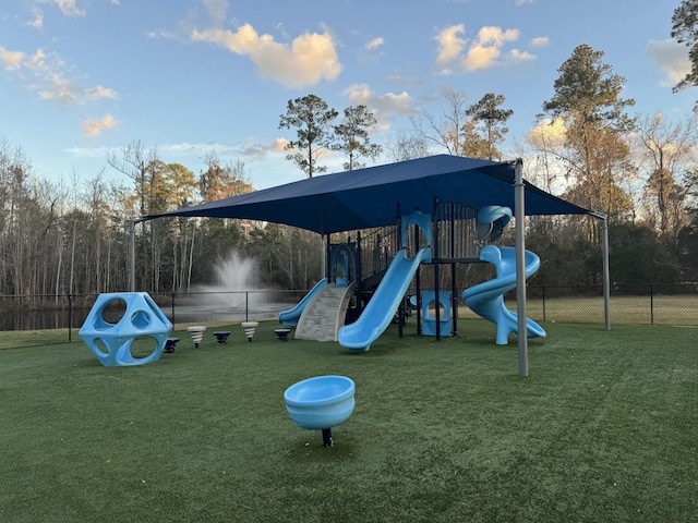 view of playground featuring a lawn