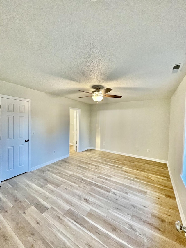 unfurnished room featuring ceiling fan and light hardwood / wood-style flooring