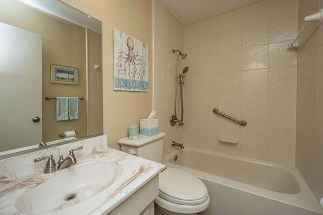 full bathroom with vanity, toilet, and tiled shower / bath combo