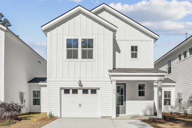 modern inspired farmhouse with concrete driveway, board and batten siding, an attached garage, and a shingled roof