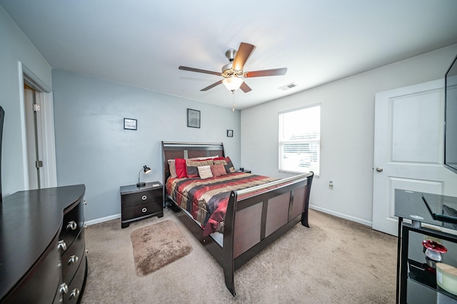 bedroom with light carpet and ceiling fan