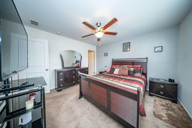 bedroom featuring light carpet and ceiling fan