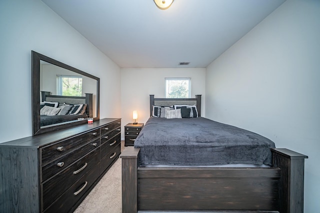 bedroom with light colored carpet