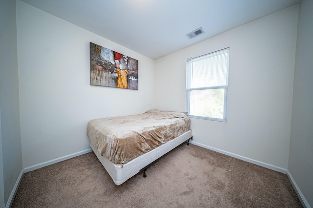 bedroom featuring carpet