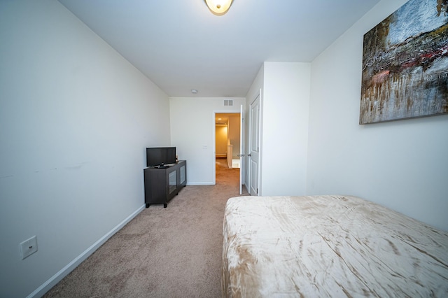 unfurnished bedroom featuring light colored carpet