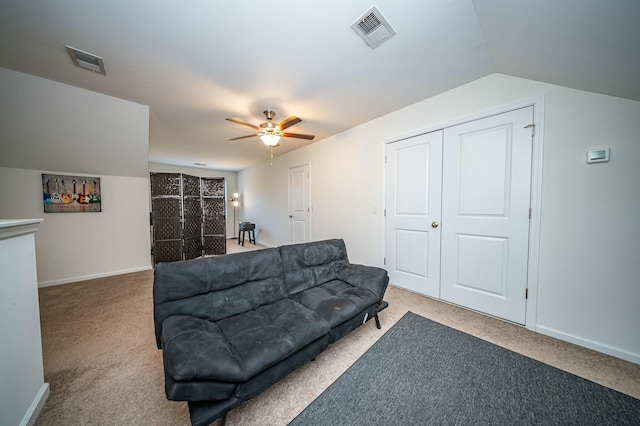 carpeted living room with lofted ceiling and ceiling fan