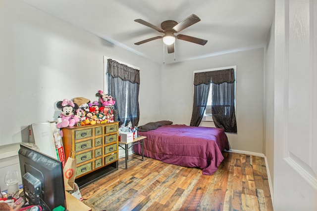 bedroom with ceiling fan and wood-type flooring