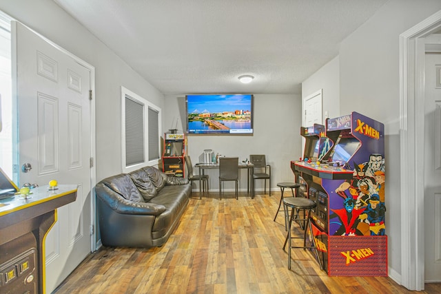 interior space with a textured ceiling and hardwood / wood-style flooring