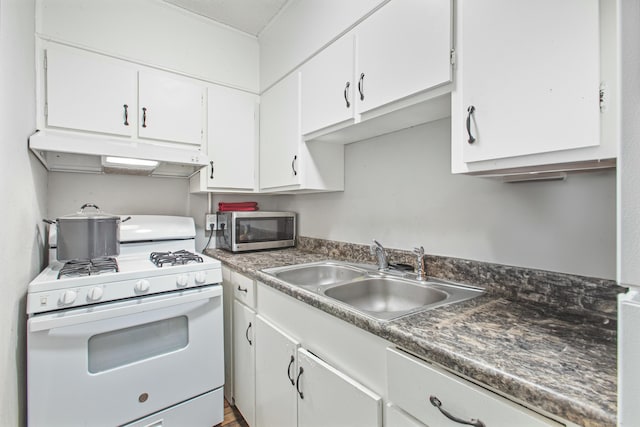 kitchen featuring white cabinetry, white gas range, ornamental molding, and sink