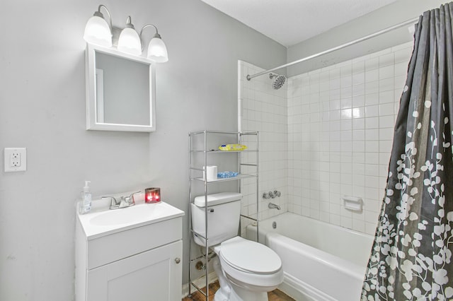 full bathroom with vanity, shower / tub combo, and toilet